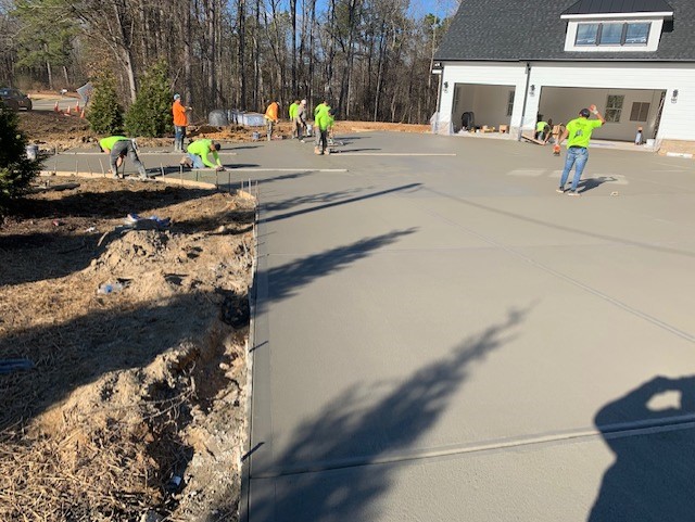 A new concrete driveway under construction by L&L Concrete.